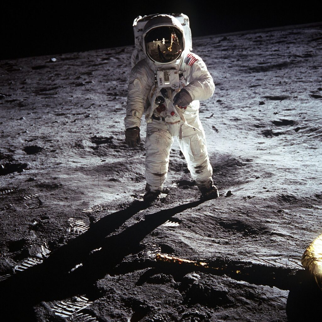 Historic image of an astronaut on the moon during the Apollo mission, showcasing space exploration.